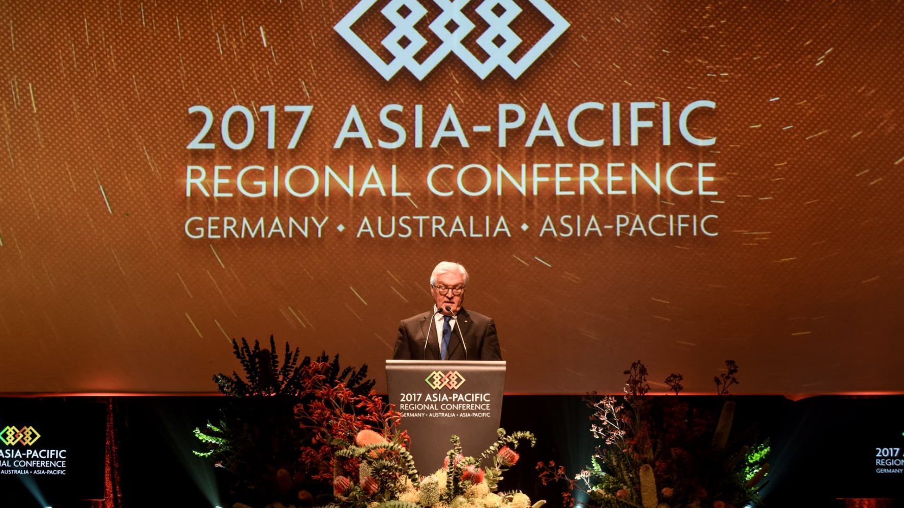 President of Germany speaking at a lectern.