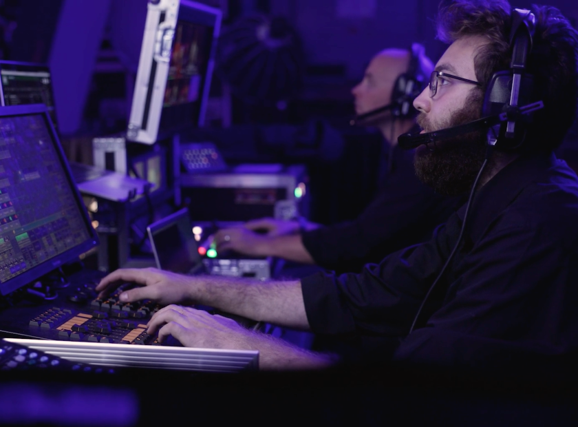 AV technicians working at front of house control positions during a live event production in Melbourne.