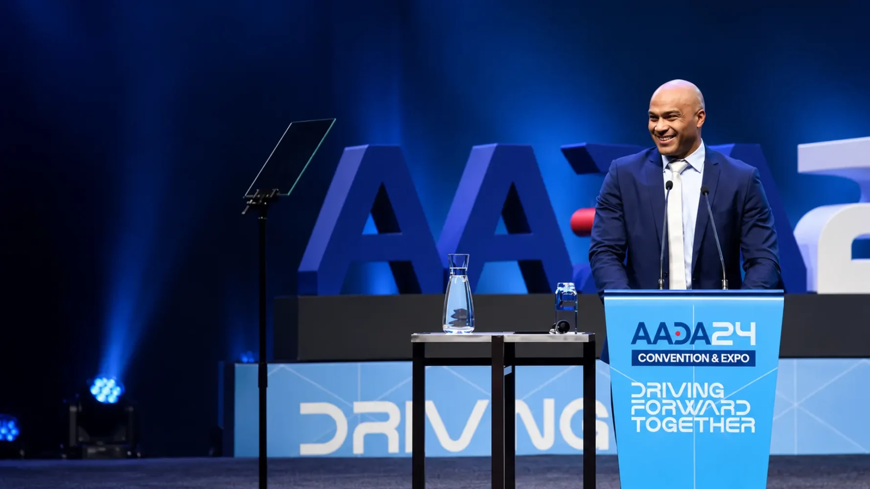 Conference and seminar AV production for the AADA Convention, with a presenter, lectern, microphones and teleprompter.