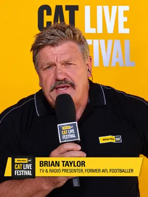 Close-up of a CAT Live Festival presenter holding a branded microphone, with an on-screen name graphic.